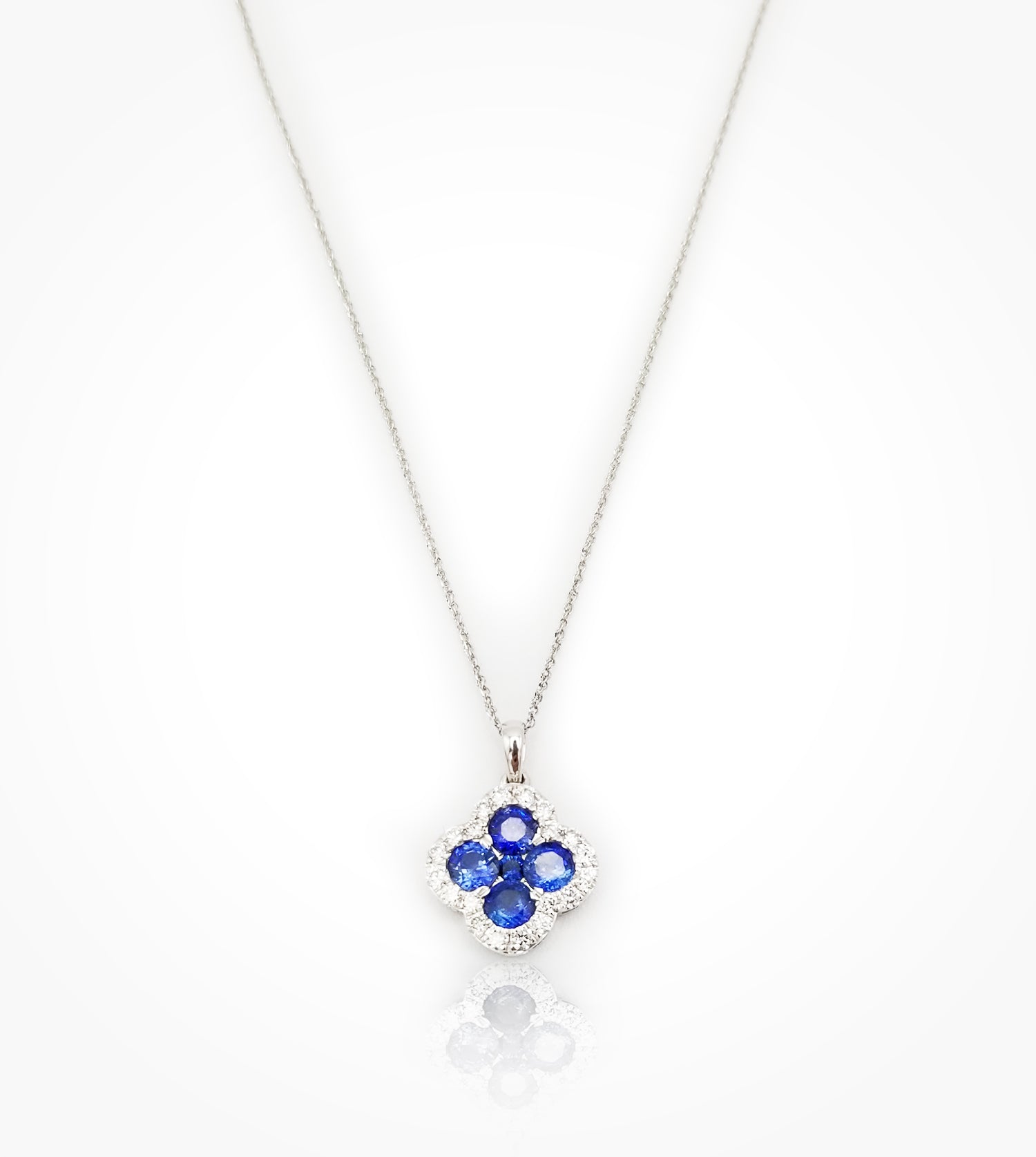PD07681 14KW quatrefoil Sapphire and Diamond pendant and chain.